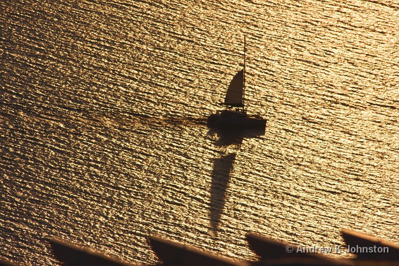 1009_40D_9643.JPG - Sailing ship against sunlit water in the Santorini caldera