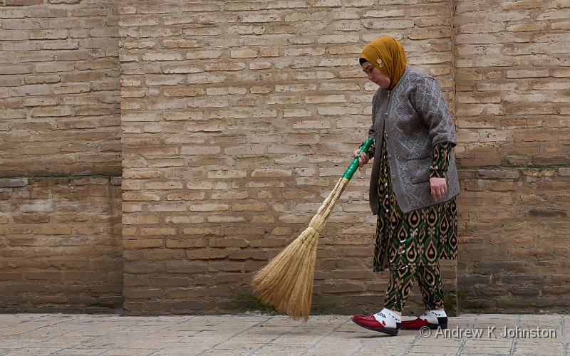 260524_G9ii_1124744.jpg - Lady cleaning at the Shah-i-Zinda Necropolis